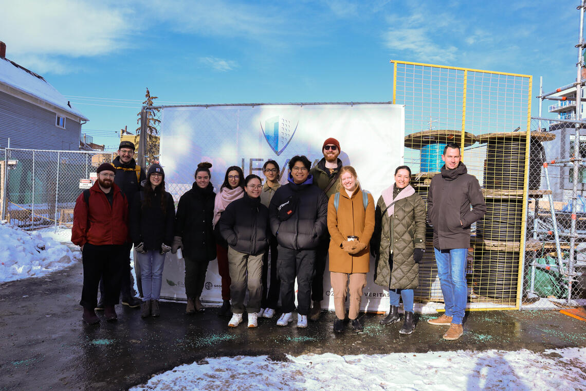 SAPL Architecture students pose for a group photo outside a construction site