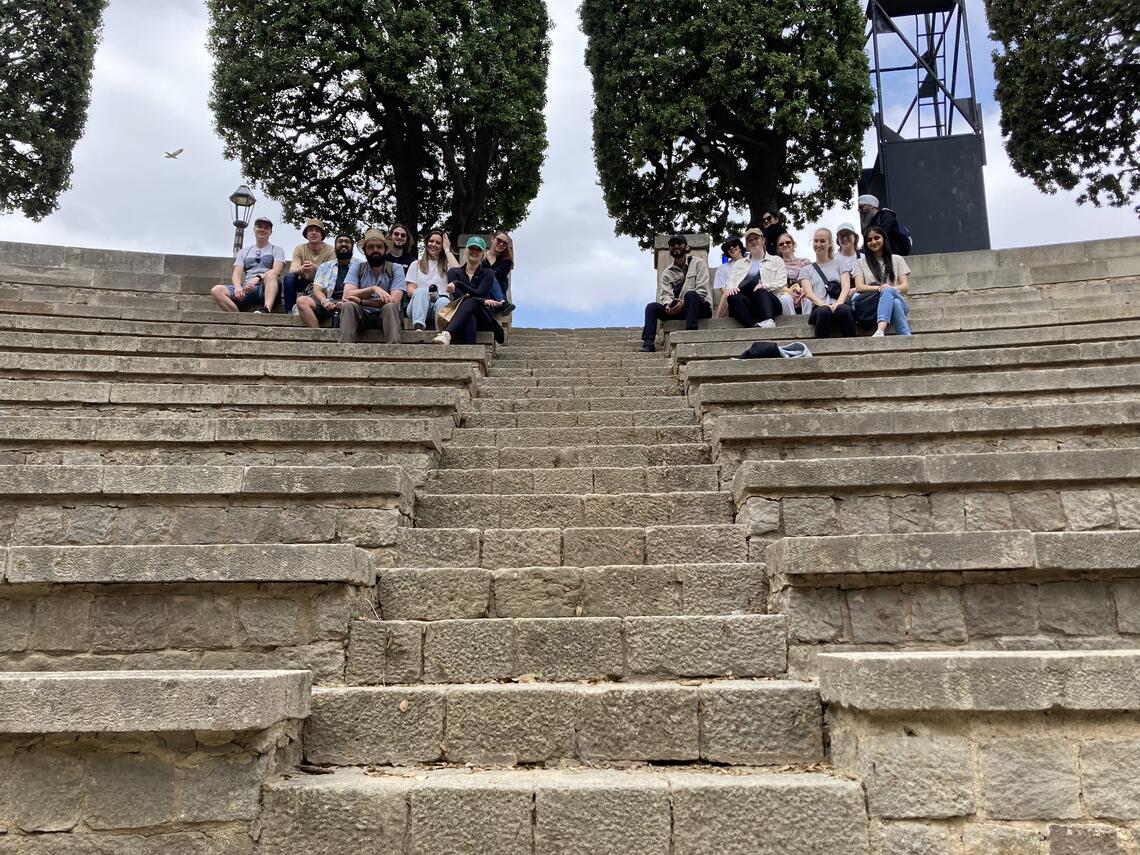 SAPL students sit in ancient stairs in Barcelona, Spain
